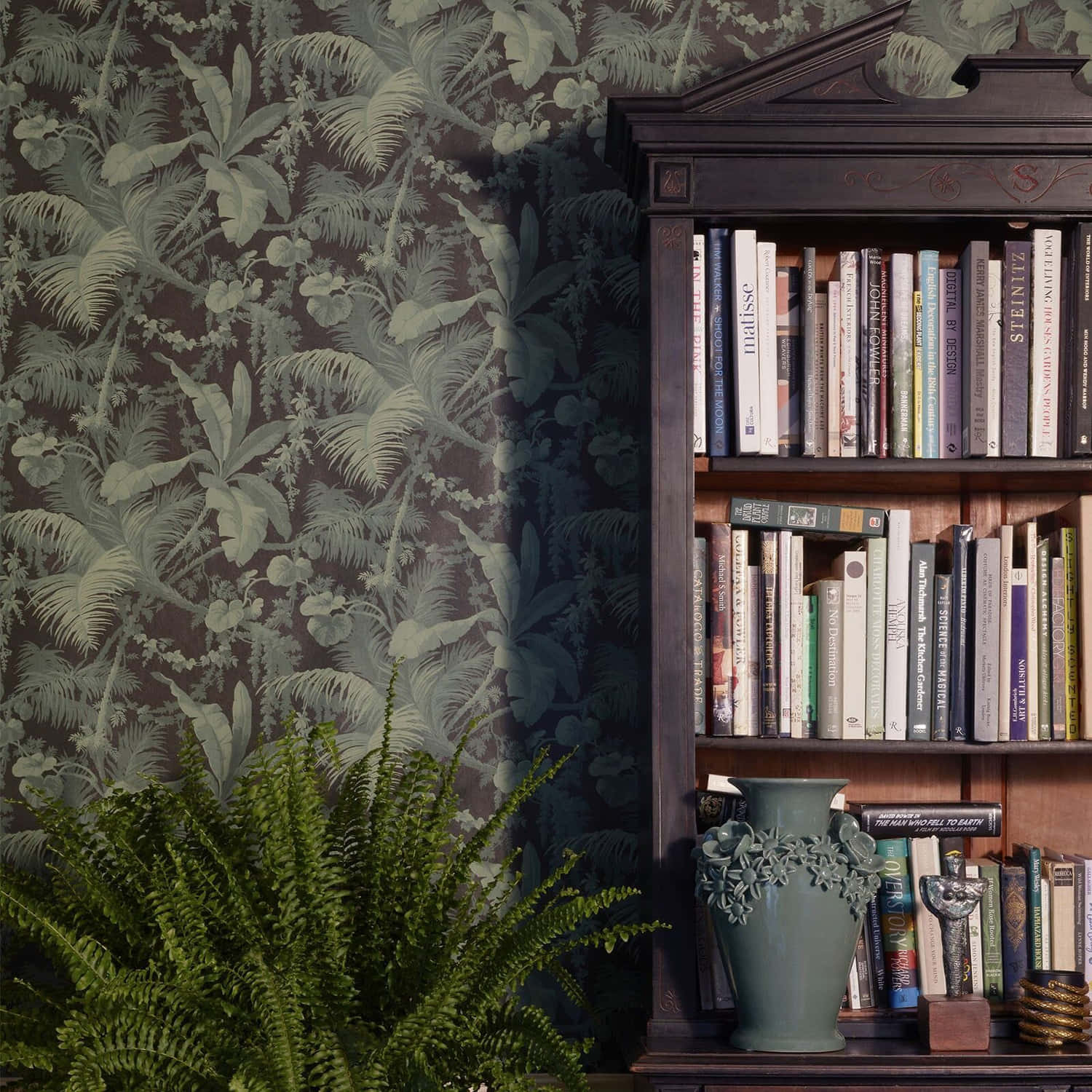 A Bookcase With A Plant On It And A Wallpaper Background