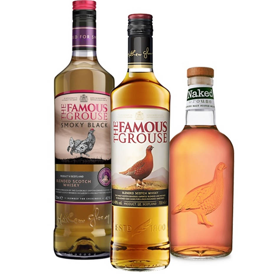 A Bottle Of Famous Grouse Smoky Black Scotch On A Wooden Cask Background