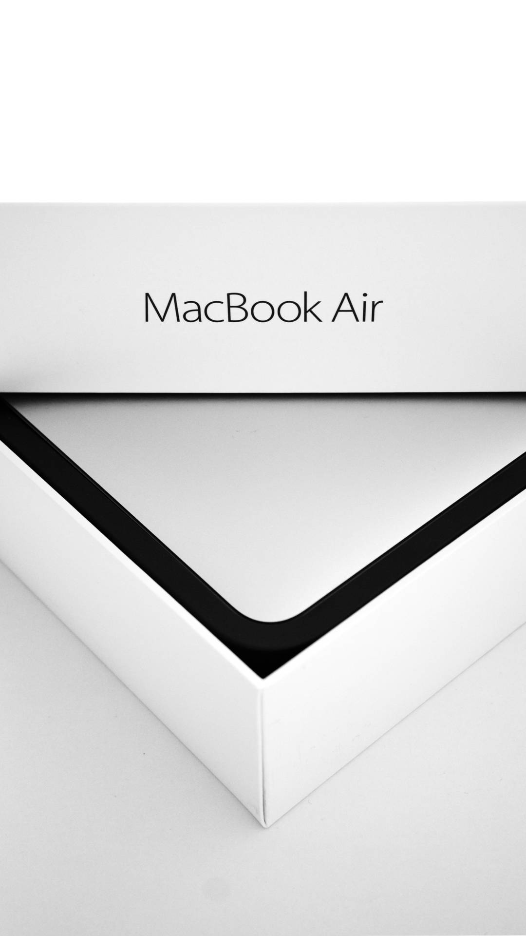 A Box Of A Macbook Air 2020 Background