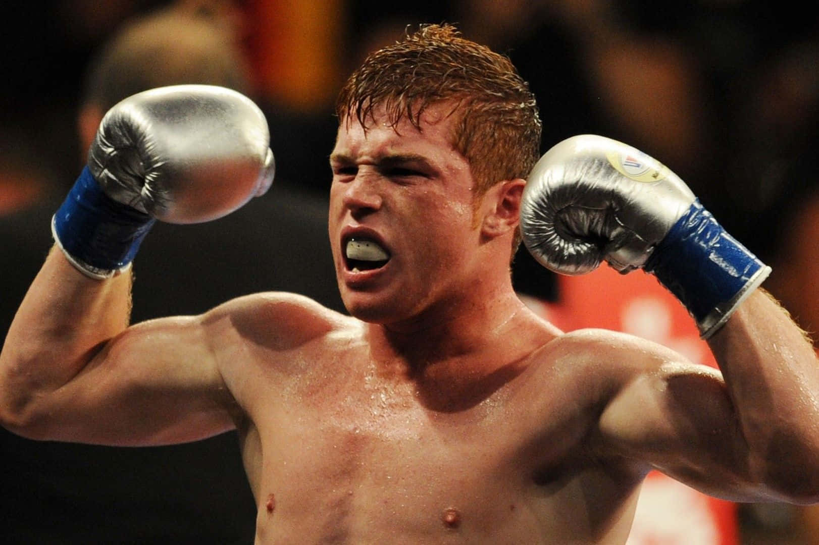 A Boxer Is Celebrating After Winning A Fight Background