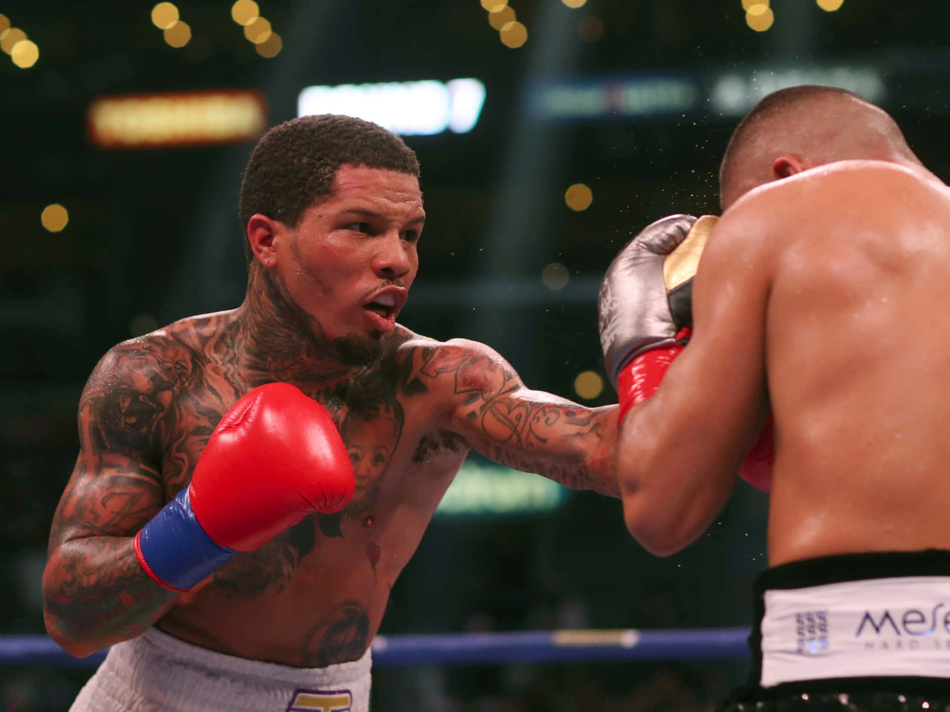 A Boxer Is Fighting Another Boxer In A Boxing Ring Background