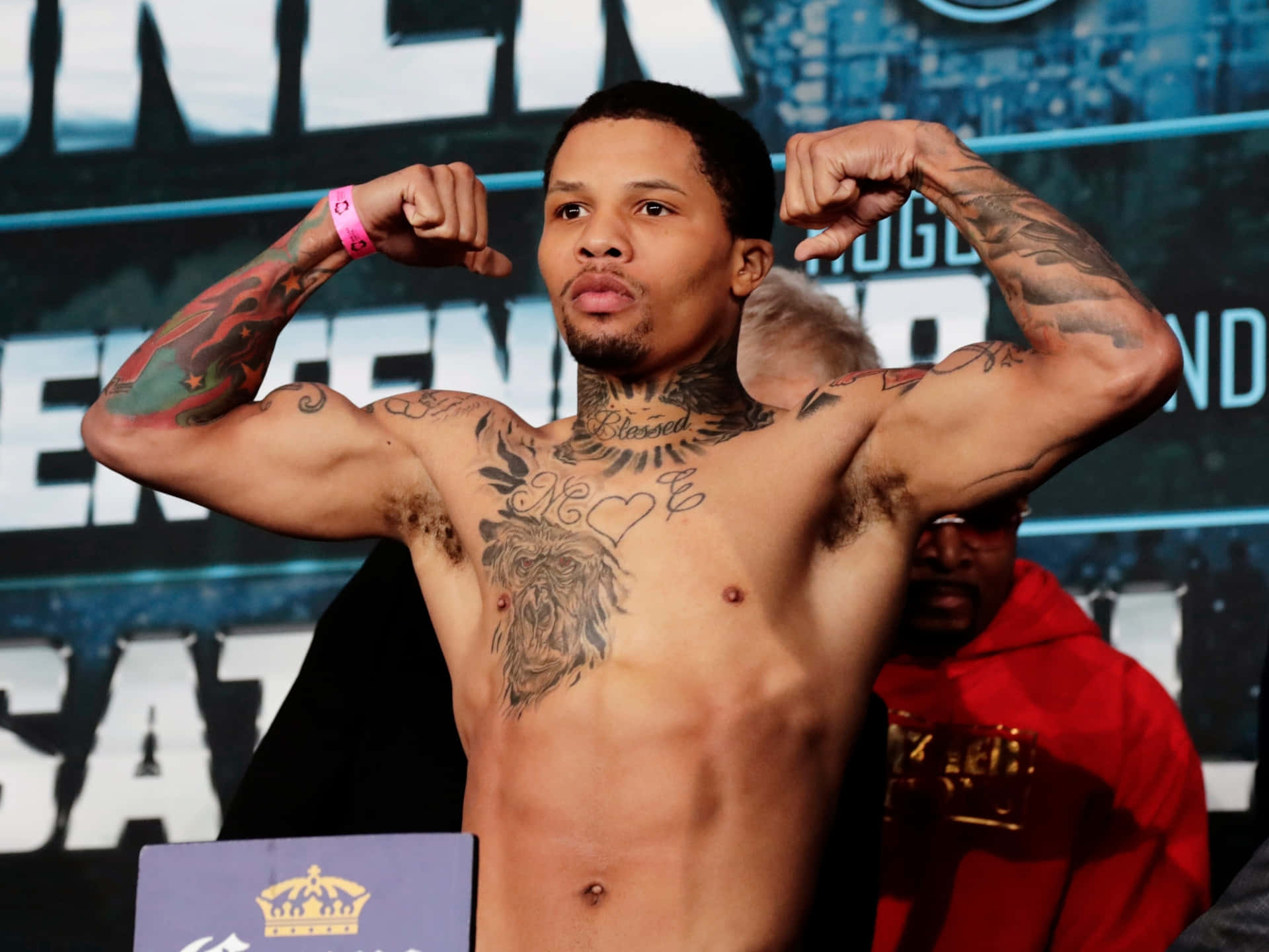 A Boxer With Tattoos Posing For A Photo Background