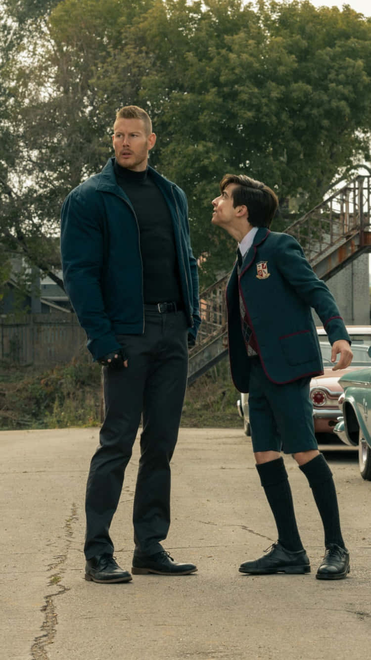 A Boy And A Girl Standing Next To Each Other Background