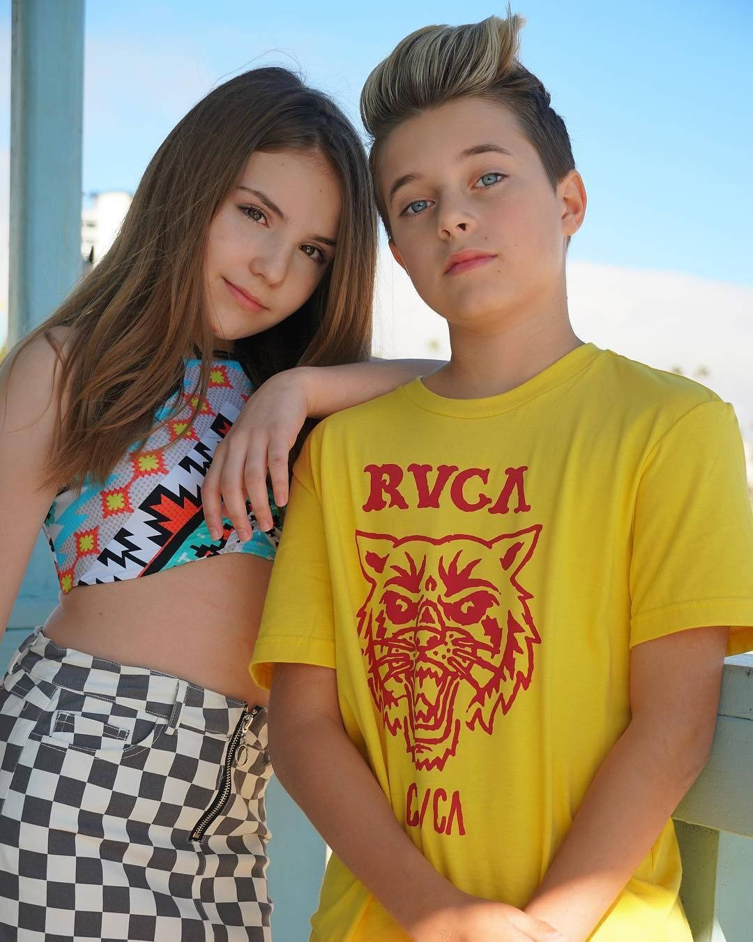 A Boy And Girl Posing For A Photo Background