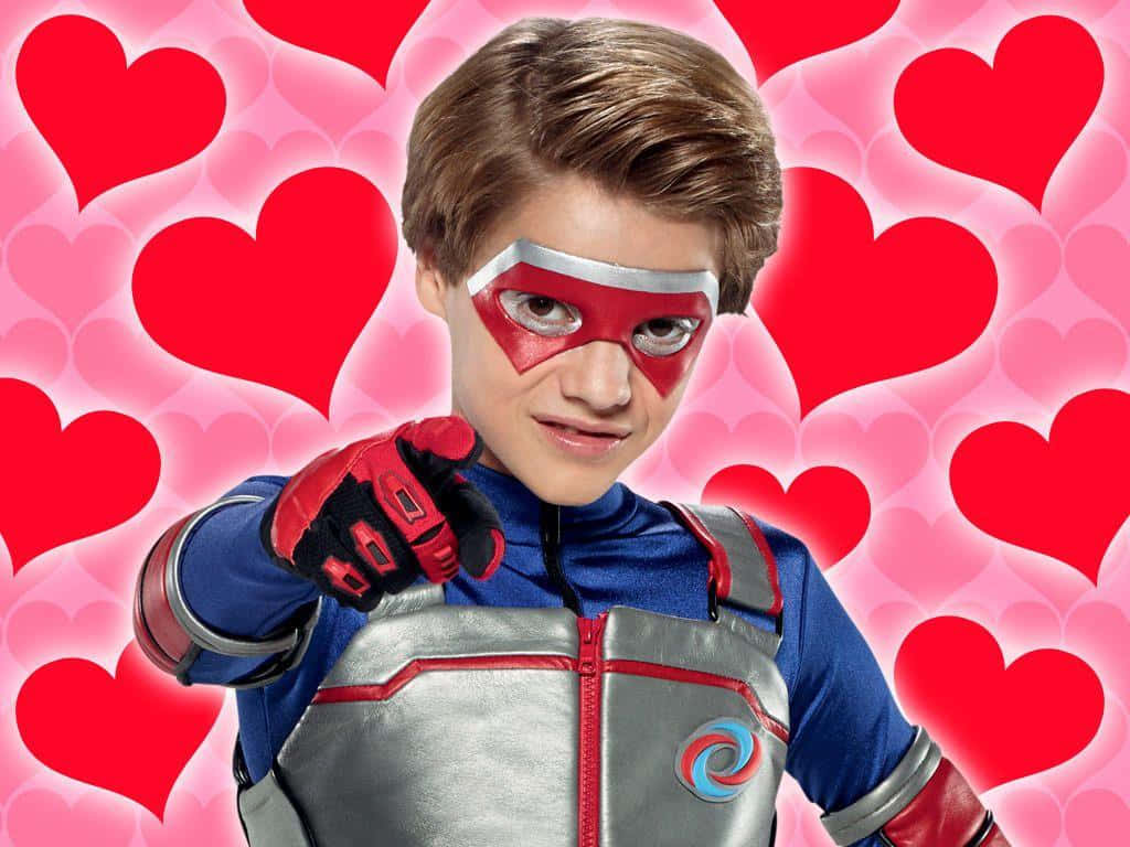A Boy In A Superhero Costume Is Pointing At Hearts Background