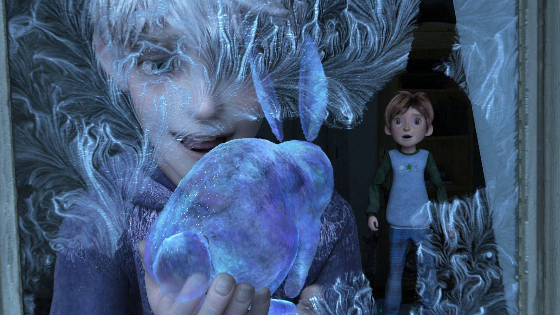 A Boy Is Holding A Frozen Ball In His Hands