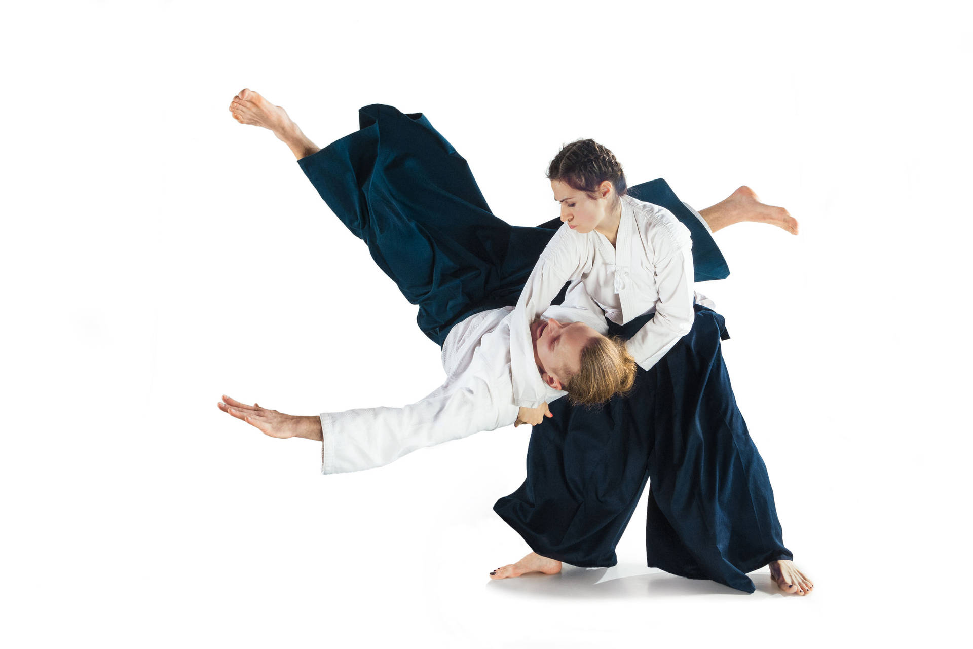 A Breakthrough Moment: Female Aikidokas Executing Koshi-nage Technique Background