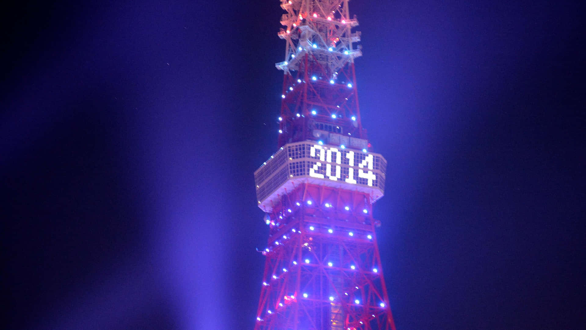 A Breathtaking Panoramic View Of The Iconic Blackpool Tower, Illuminated Against The Night Sky On New Year's Eve Background