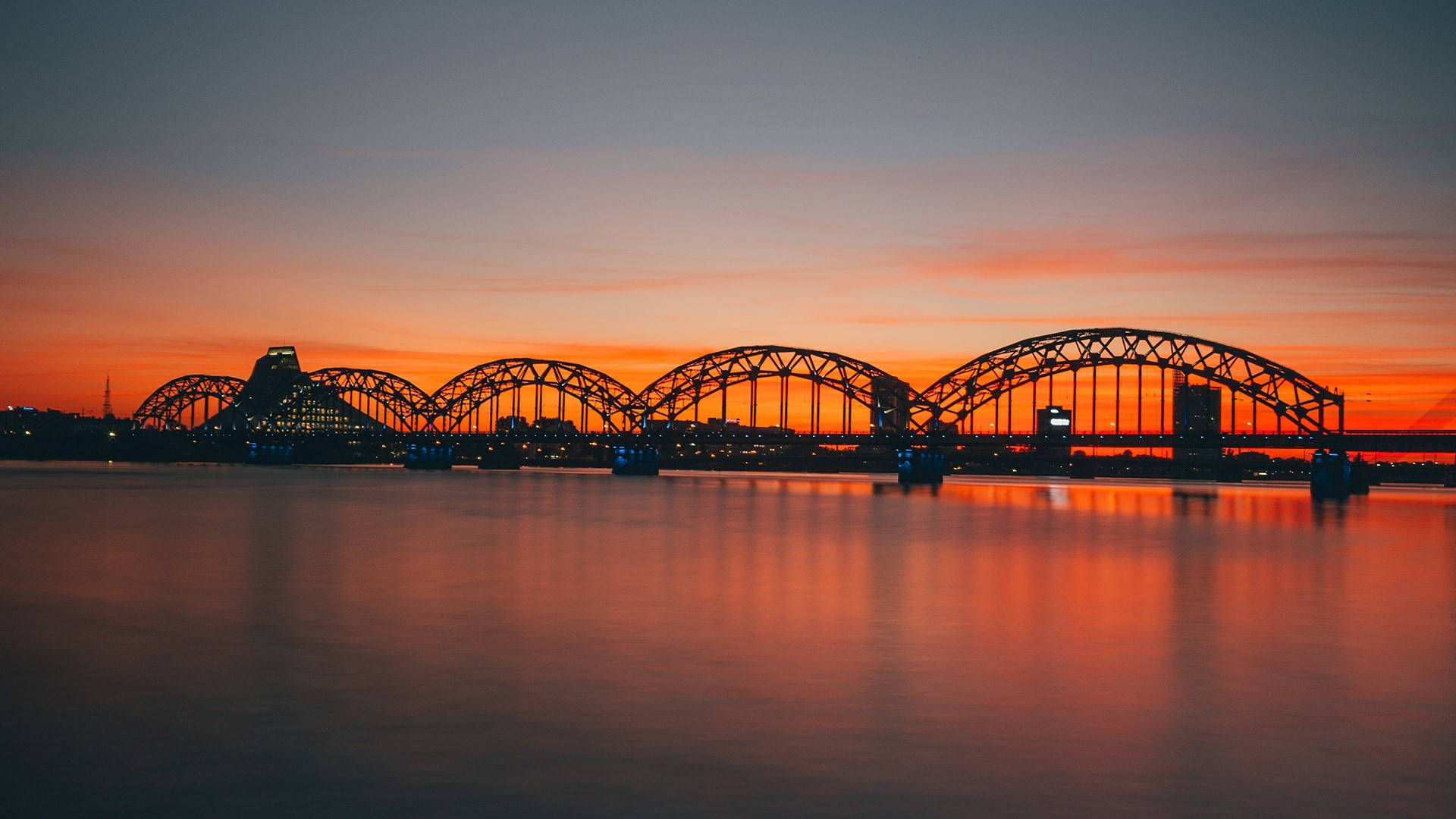 A Breathtaking Sunset At Riga's Railway Beach Background