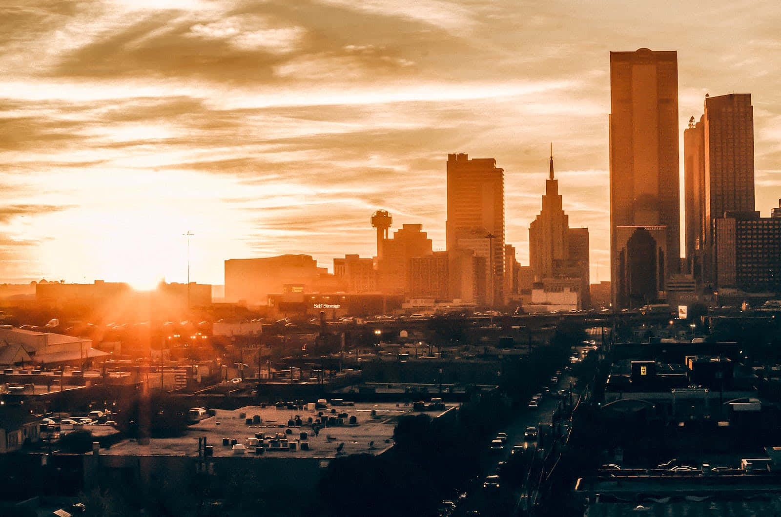 A Breathtaking Sunset Casts A Golden Hue Over The Horizon