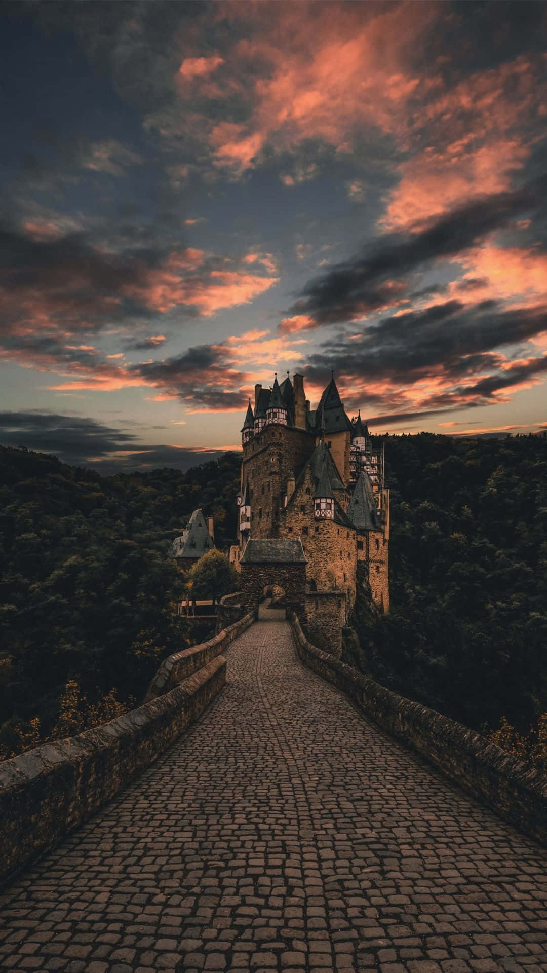 A Breathtaking View Of A Castle In The Middle Of A Grand Landscape Background