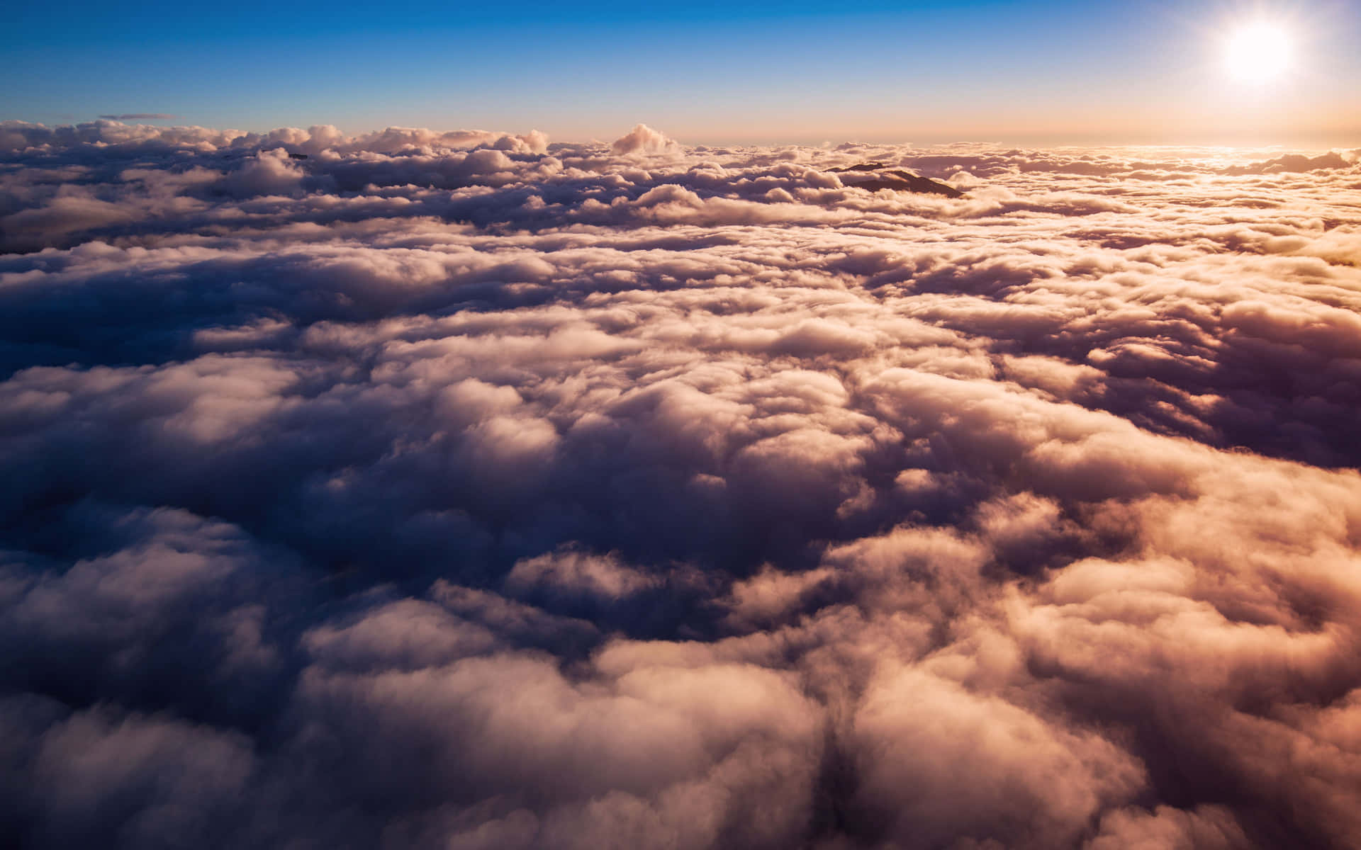 “a Breathtaking View Of The Sun Setting Over The Horizon, With Clouds Illuminated In Oranges And Purples” Background