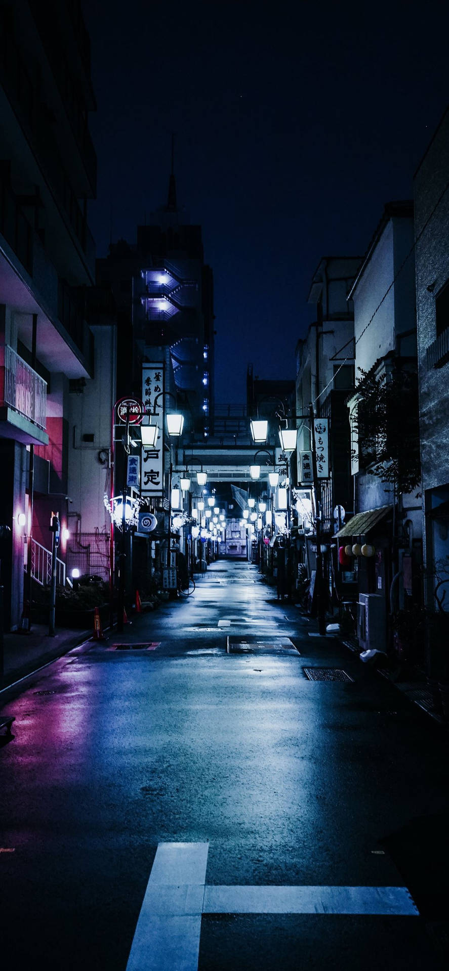 A Breathtaking View Of The Vibrant City Skyline At Night Background