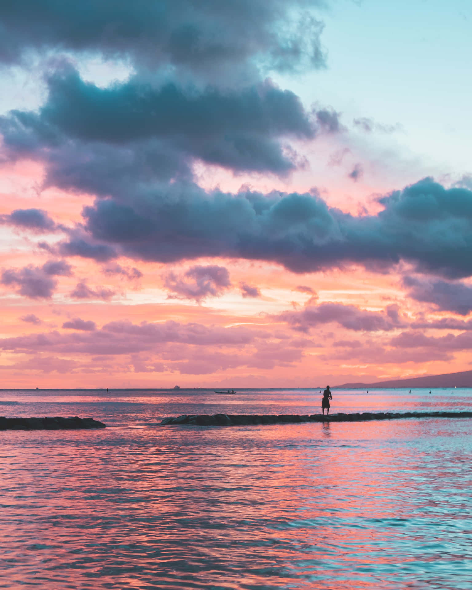 A Breathtakingly Beautiful View Of A Powder Just Beach Surrounded By A Kaleidoscope Sky Background