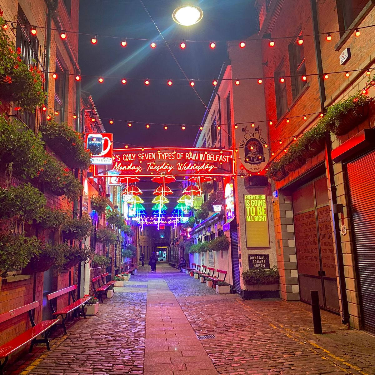 A Brick Walkway With Lights