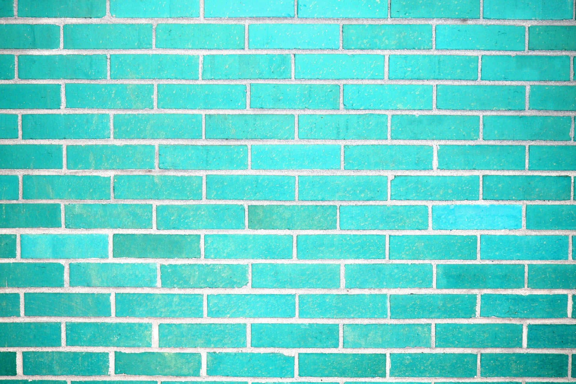 A Brick Wall With A Turquoise Color Background