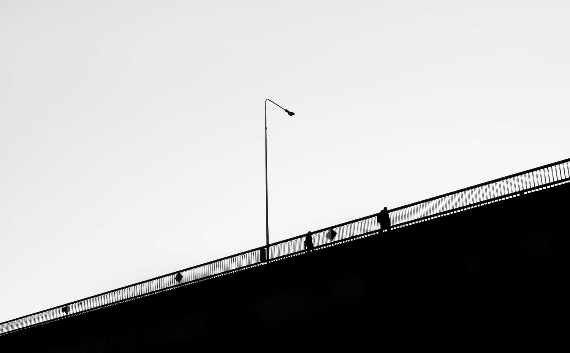 A Bridge With A Light Pole Background