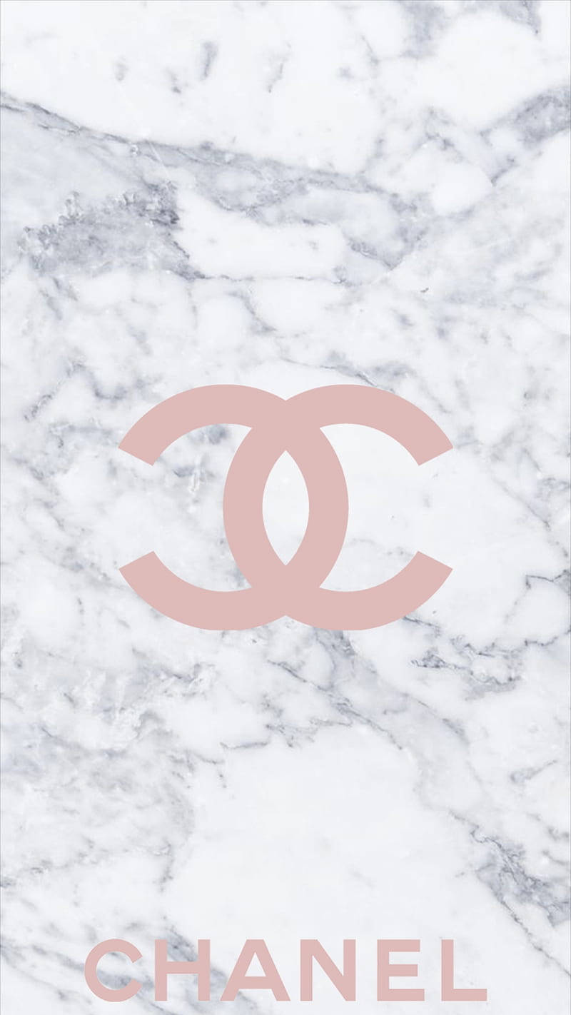 A Bright Pink Chanel Logo Against A White Background. Background