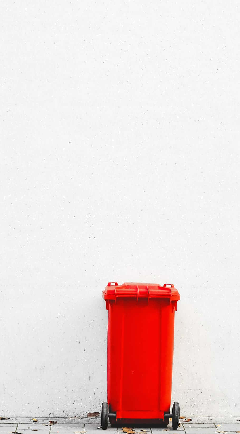 A Bright Red Wheelie Trash Can Background