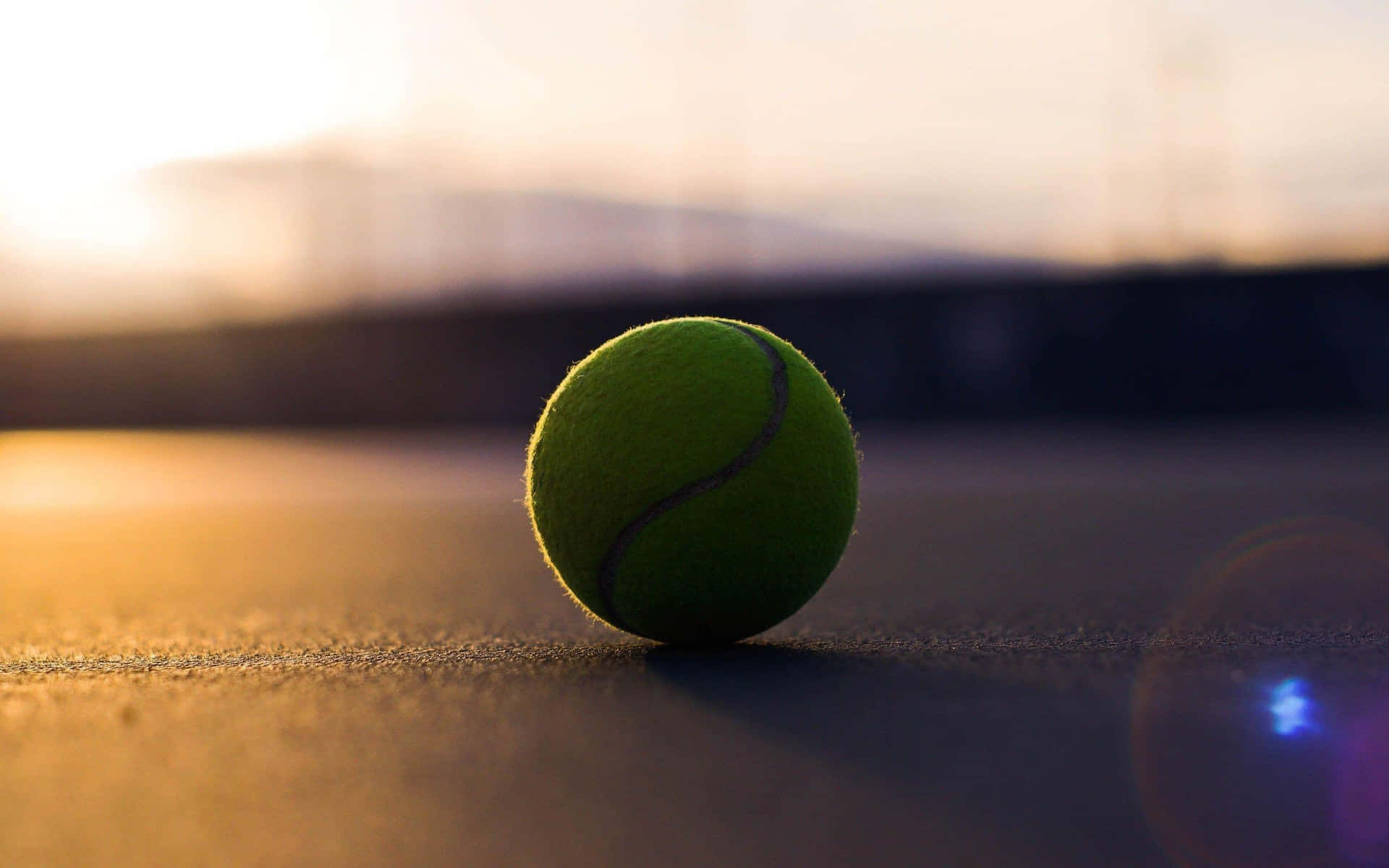 A Brightly Colored Tennis Ball On A Fresh White Background. Background
