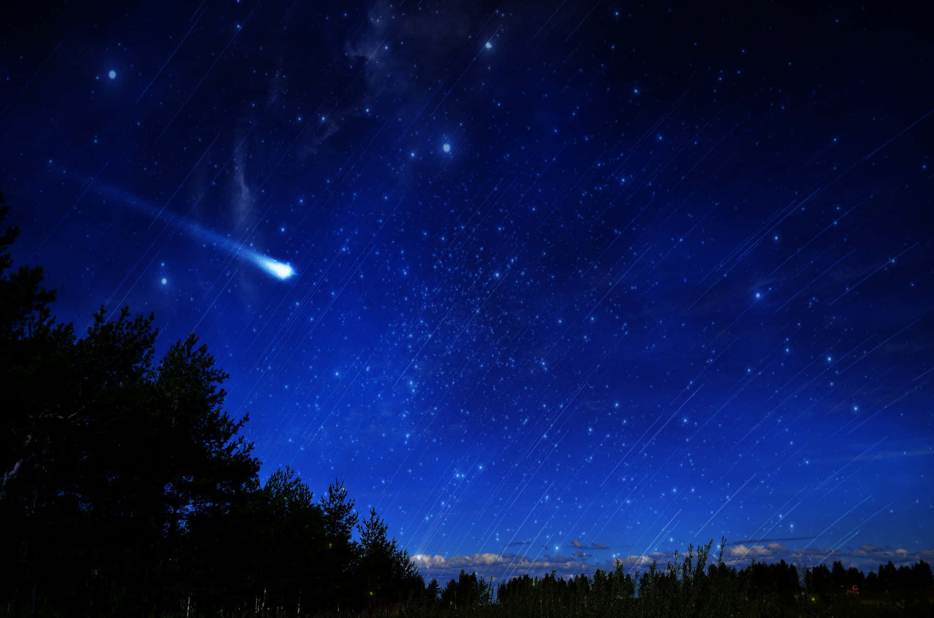 A Brilliant Comet Passing Through The Night Sky Background