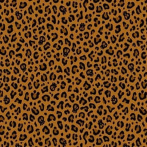 A Brown And Black Leopard Print Fabric