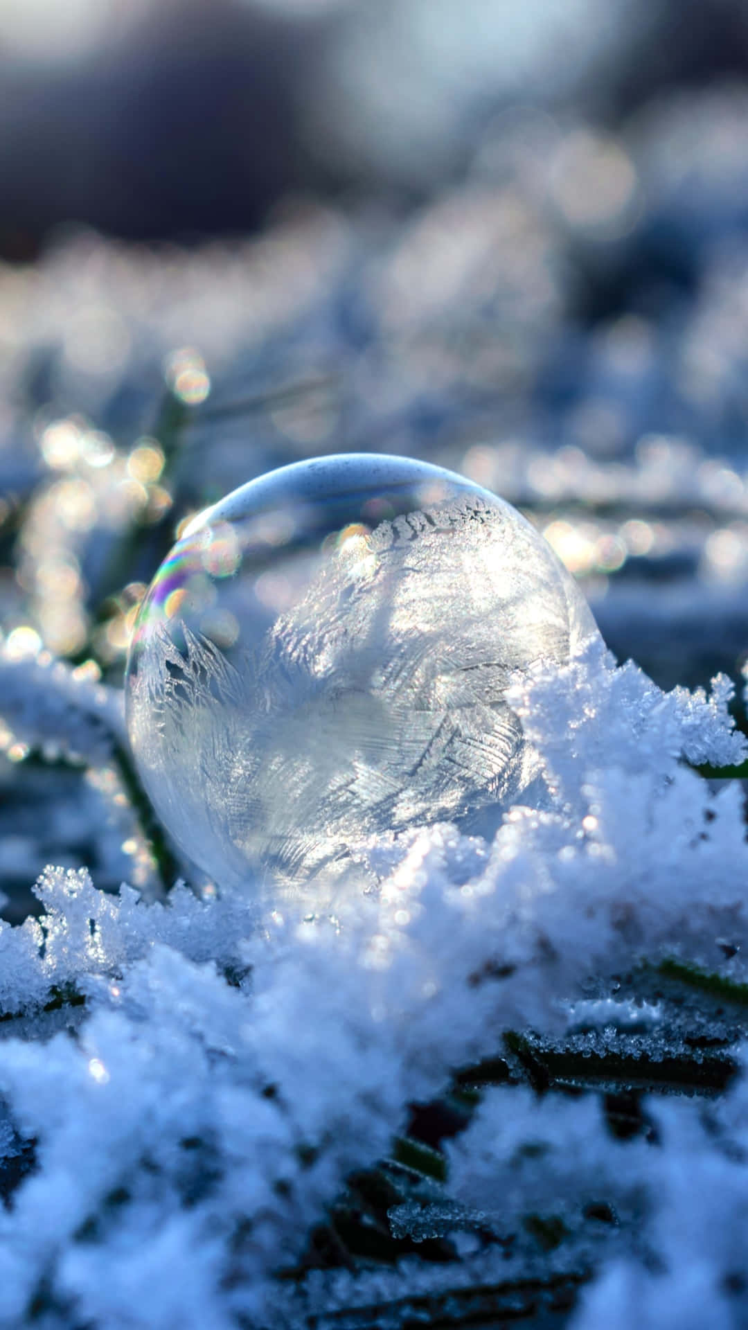 A Bubble Sitting On Top Of Snow Background