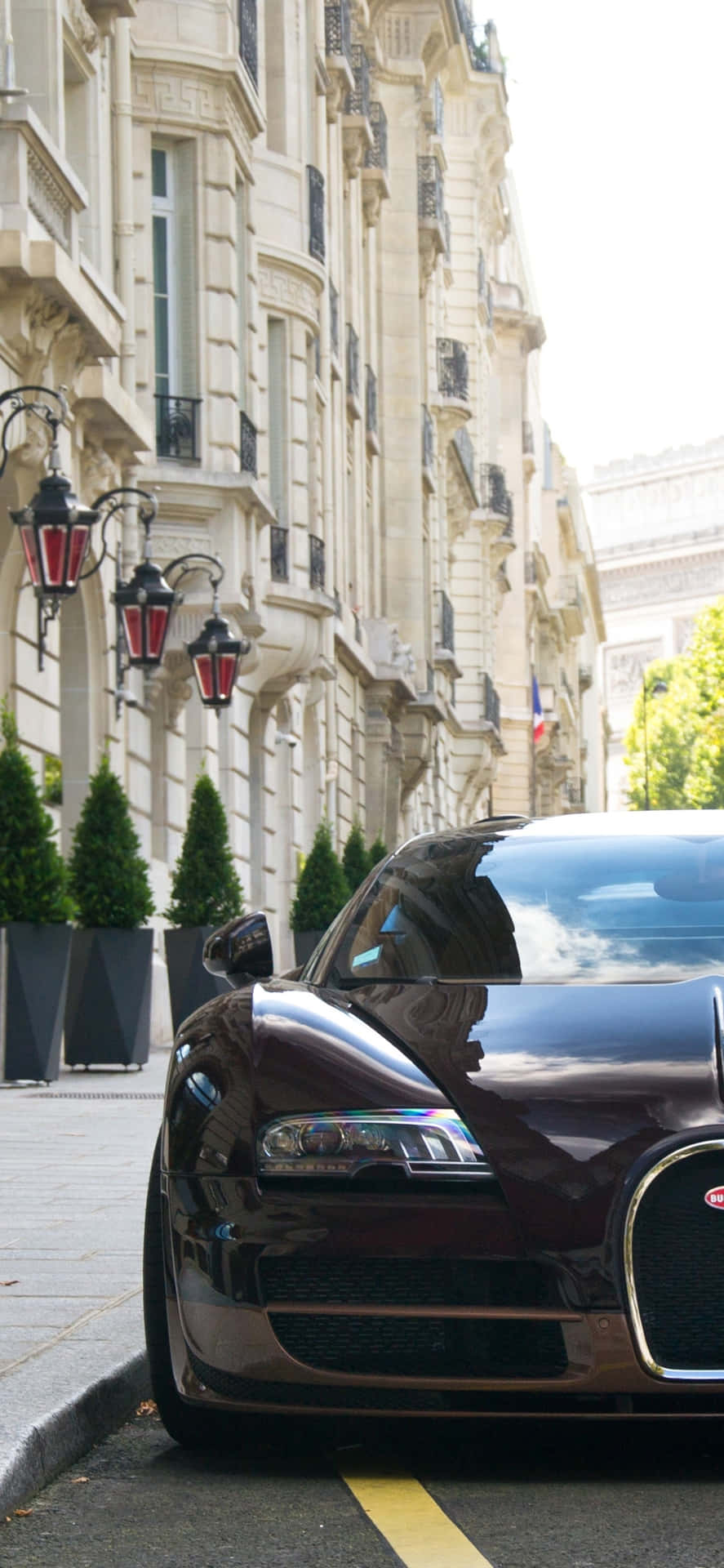 A Bugatti Veyron Parked On The Street Background