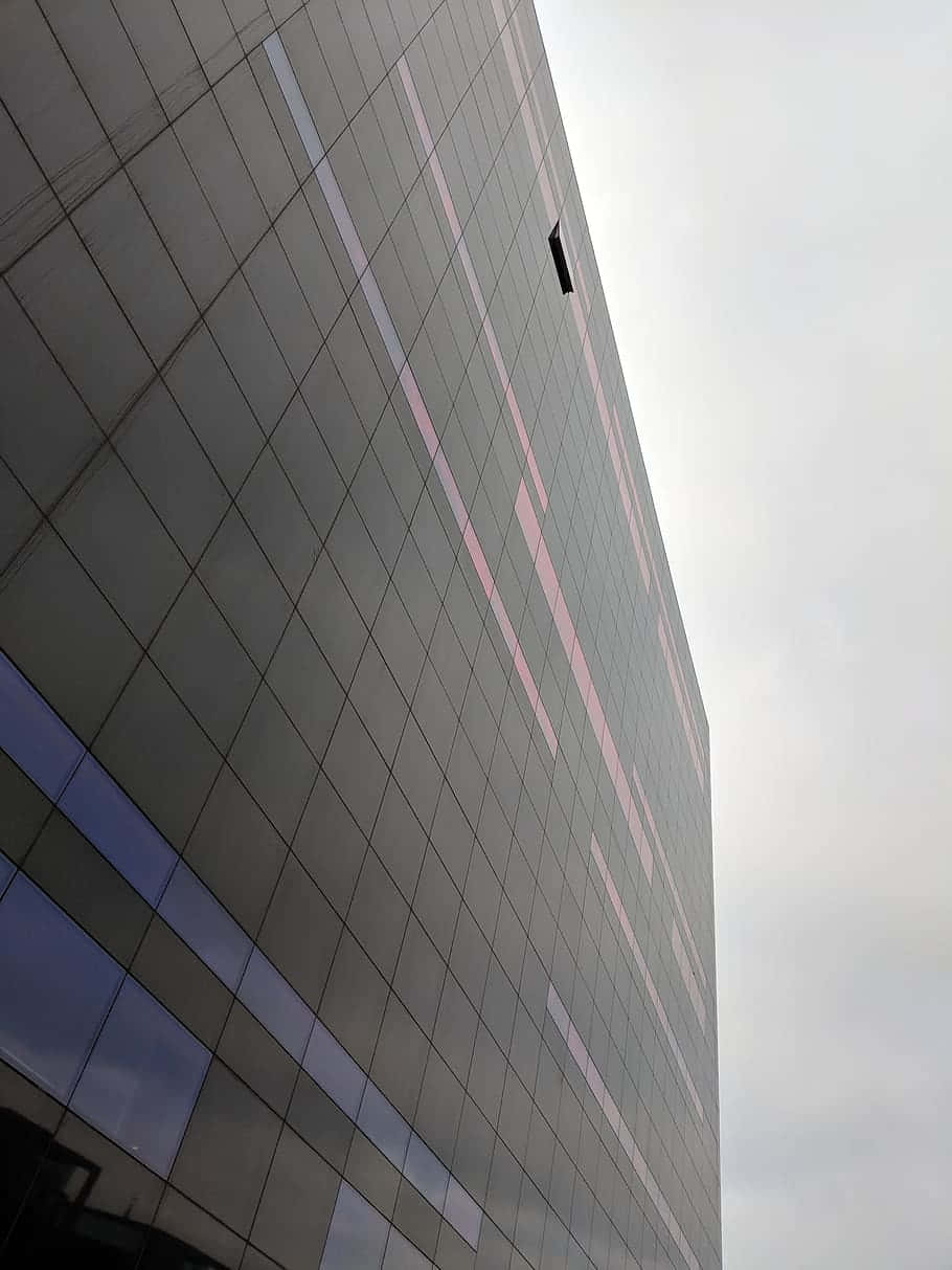 A Building With A Sky Blue Sky Background