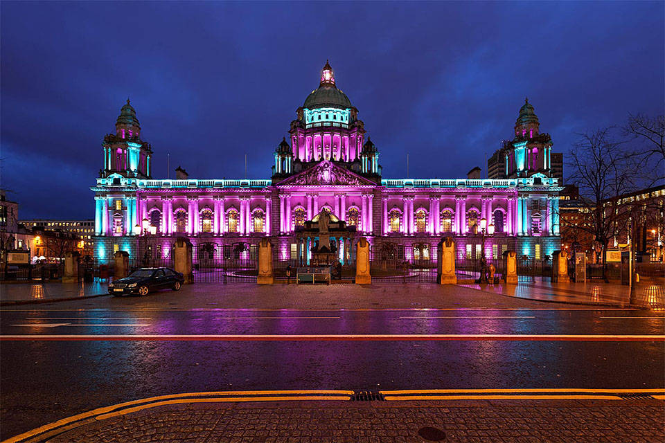 A Building With Lights On It Background