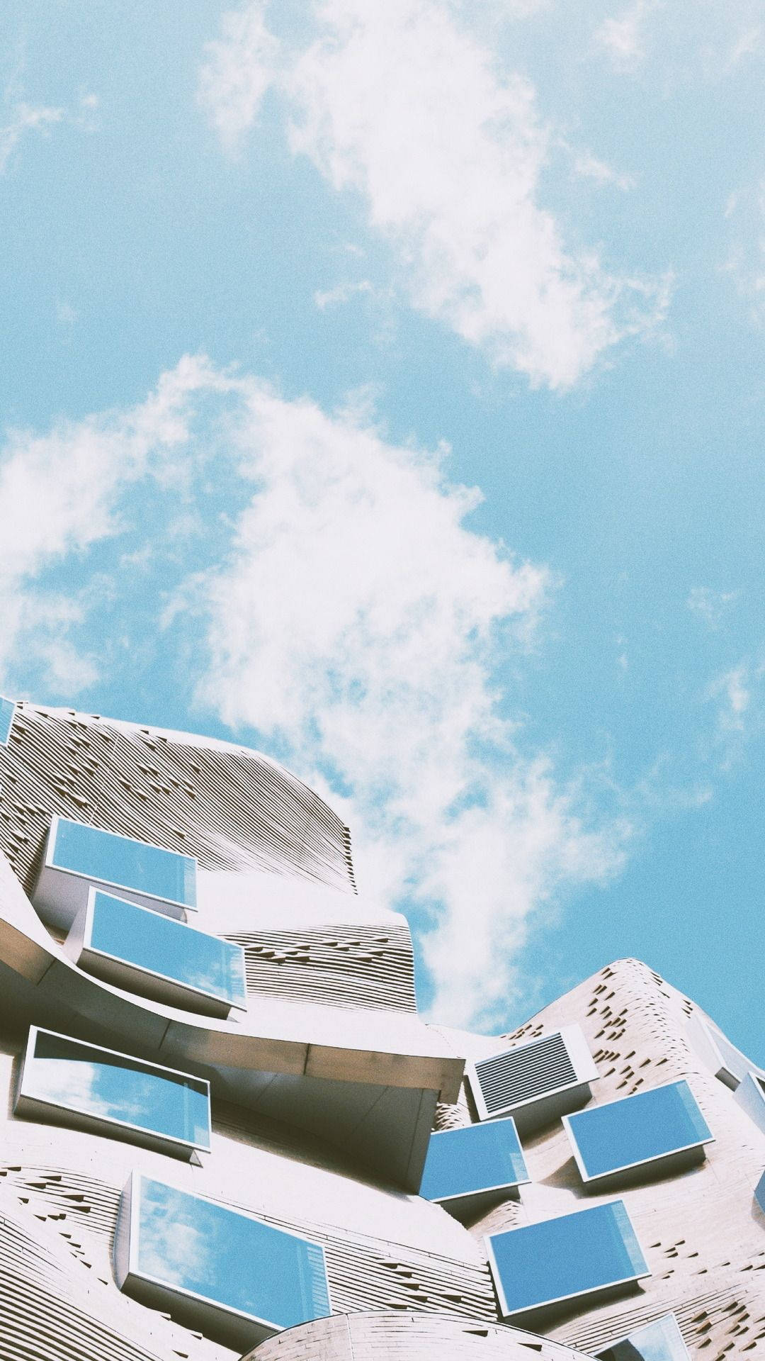 A Building With Windows And A Clock Background