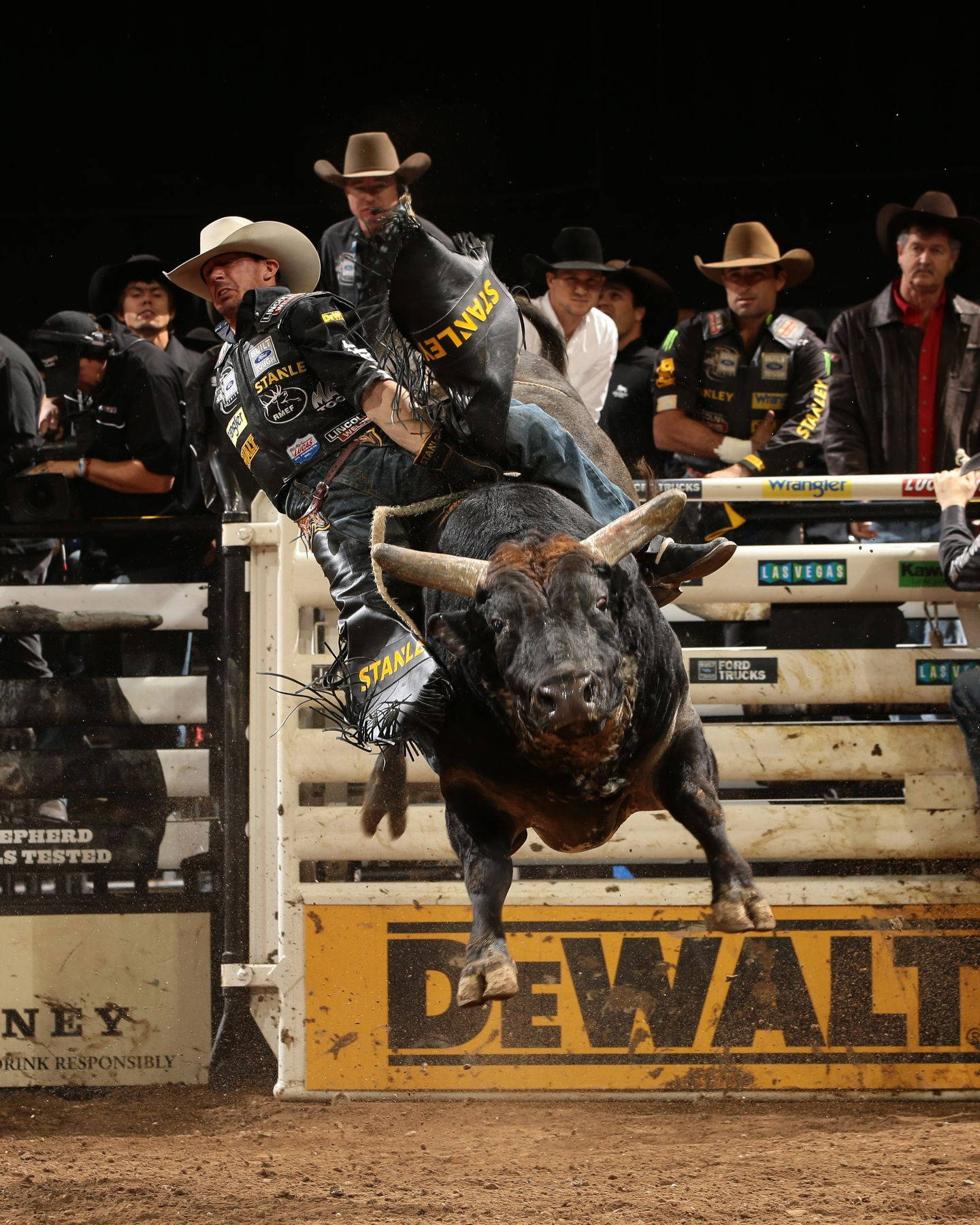 A Bull Rider Is Bucking A Bull Background