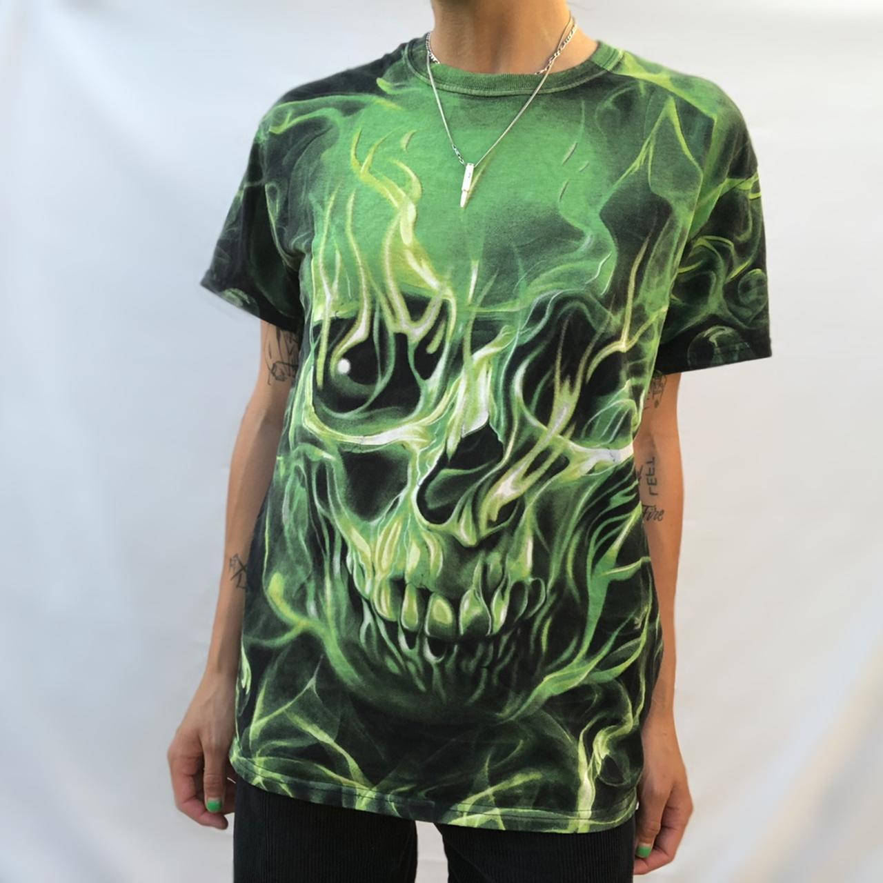 A Burning Green Skull Atop A Menacing Fiery Background Background