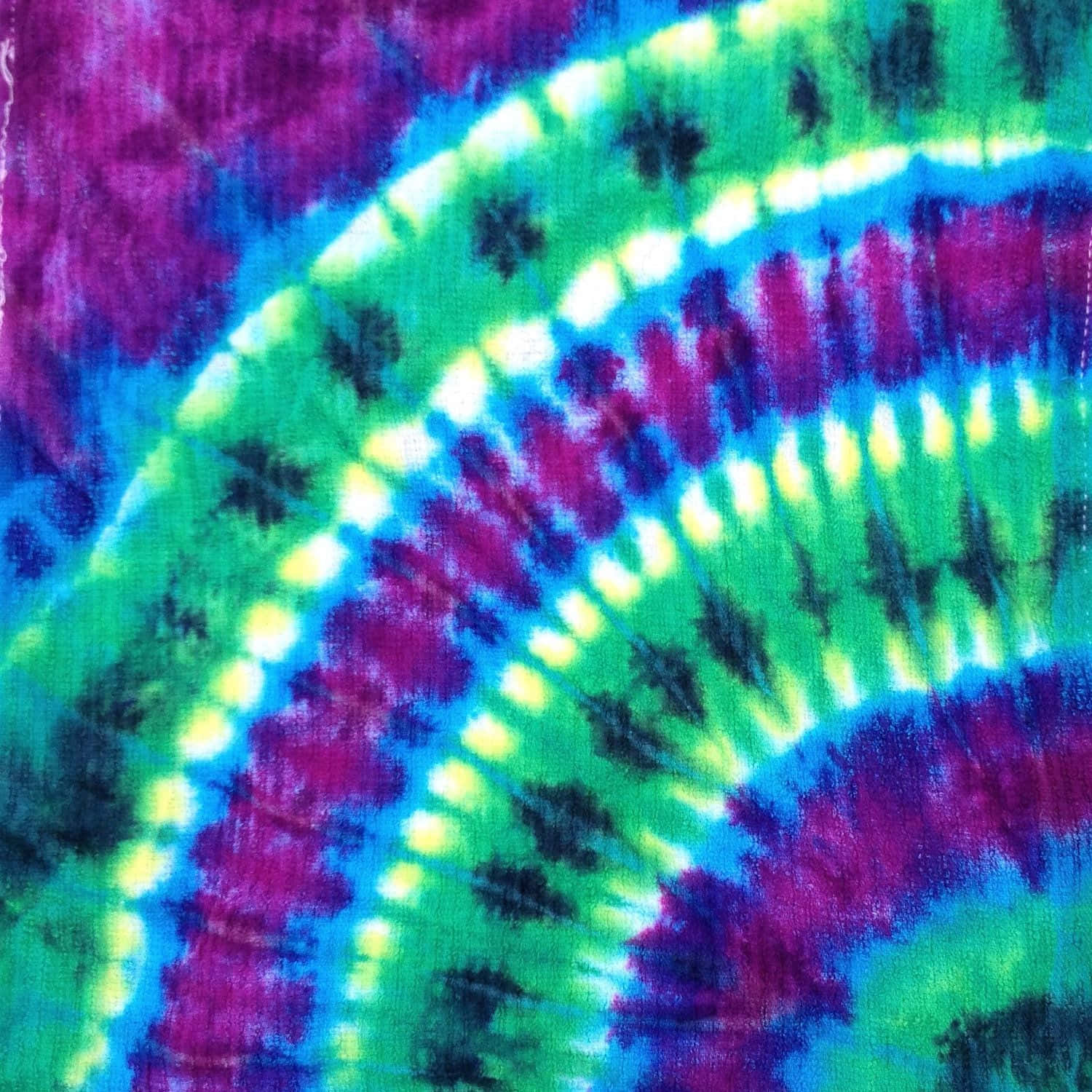 A Burst Of Colorful Magenta And Purple Tiedye Background