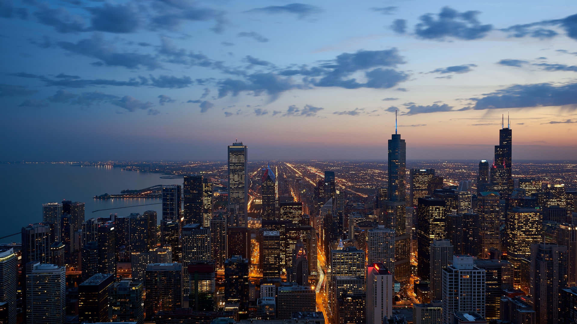 A Bustling City Skyline During Sunset Background