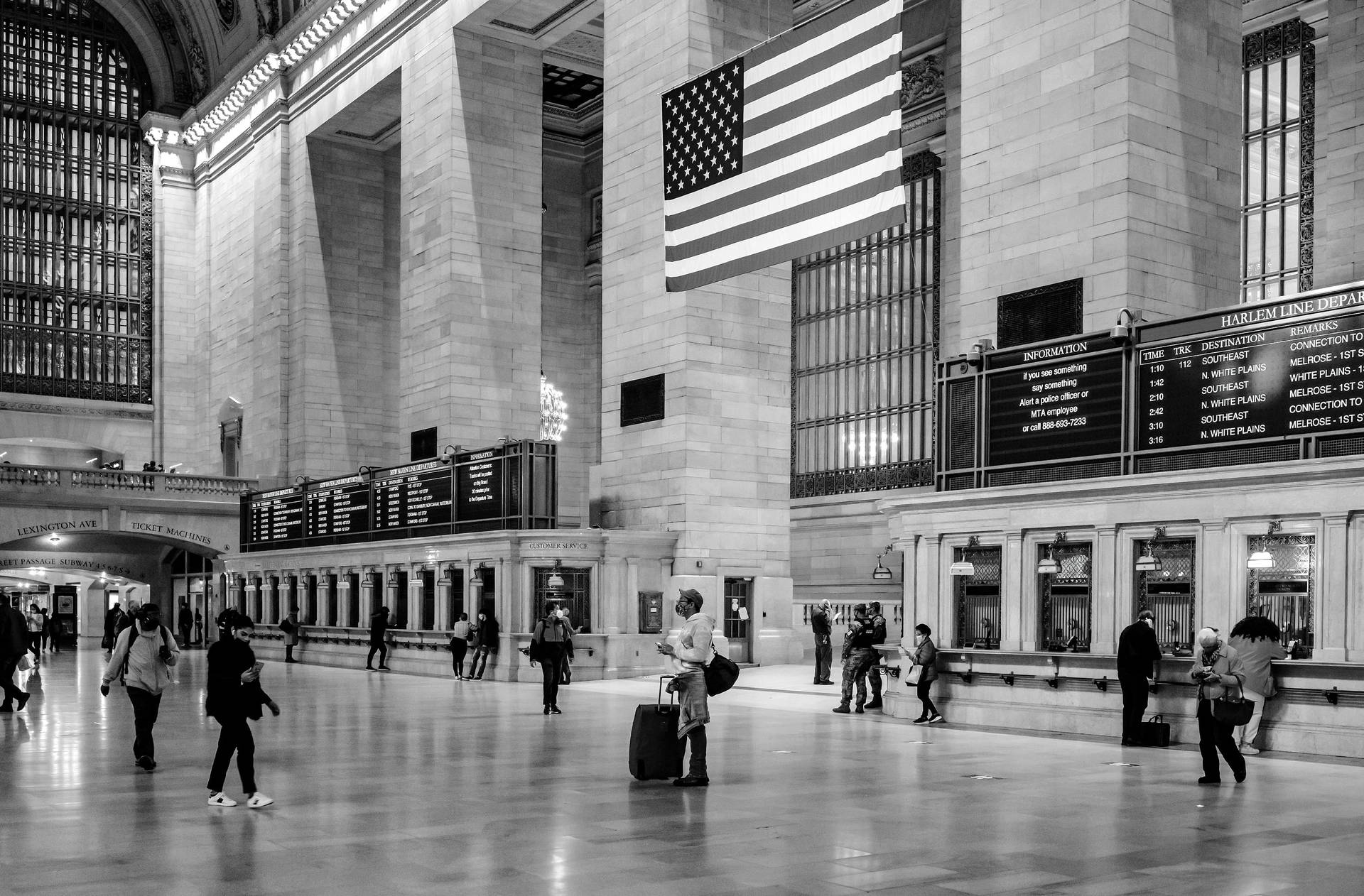 A Bustling Grand Central Station Filled With Bustling Tourists.