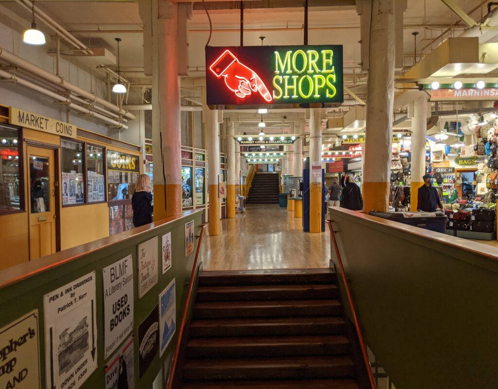 A Bustling Scene At The Pike Place Market Background