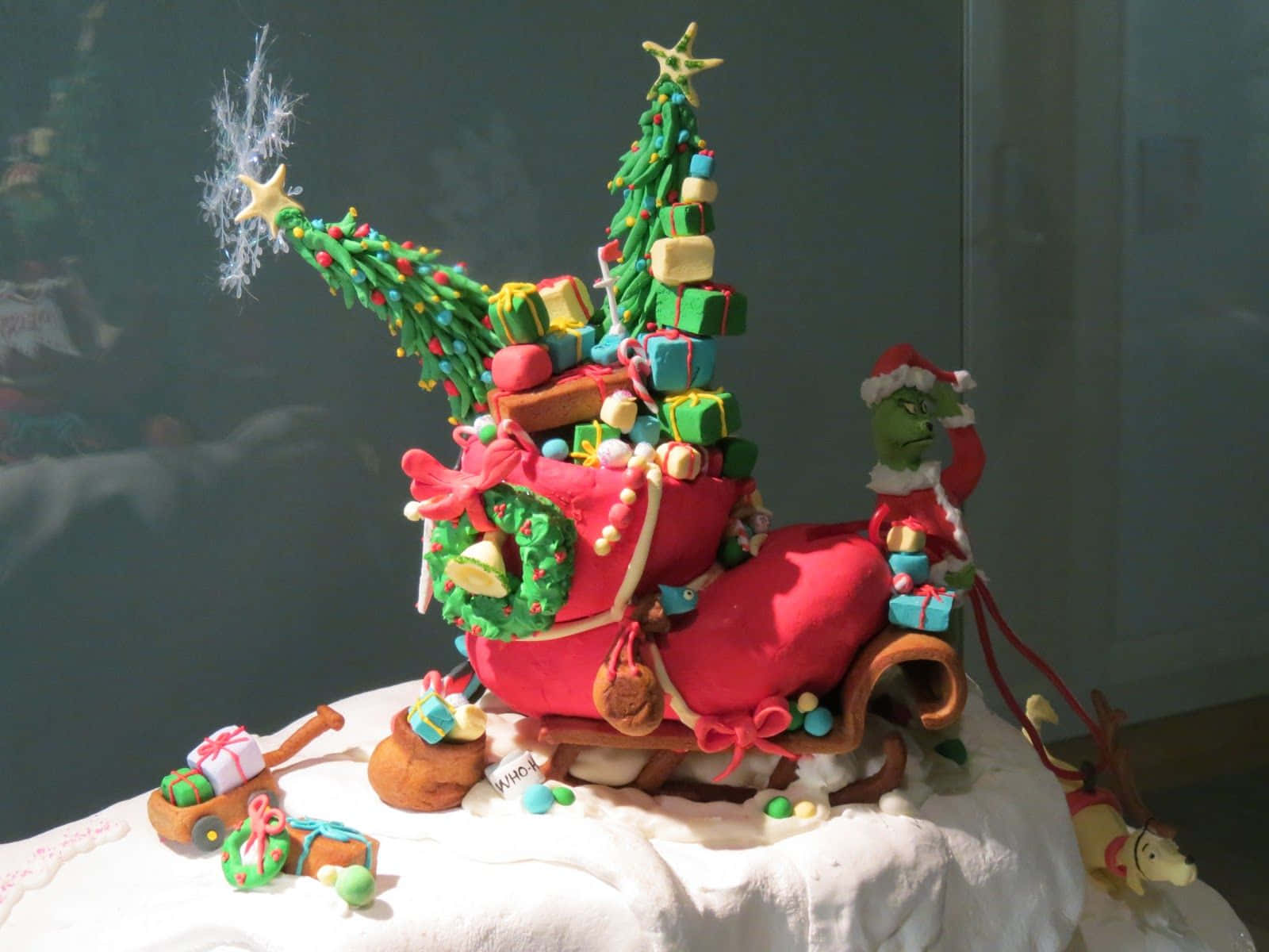 A Cake Decorated With Christmas Trees And Decorations Background