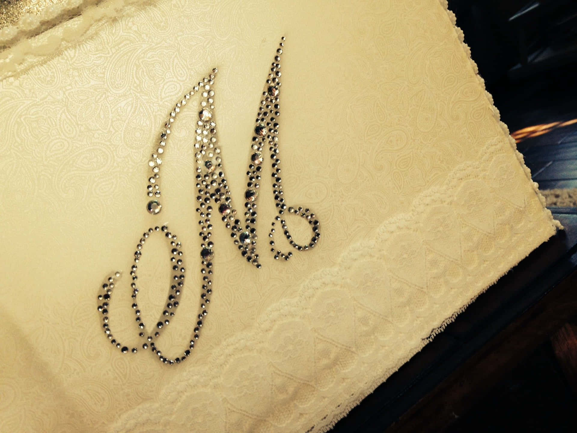 A Cake With A Monogram On It Background