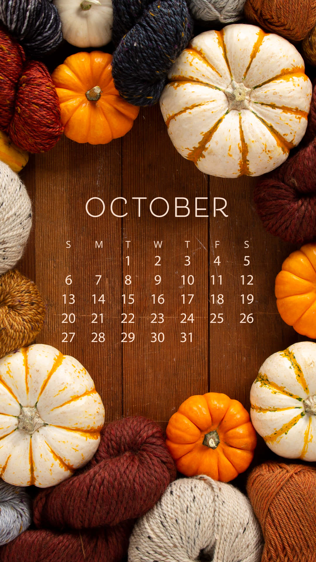 A Calendar With Pumpkins And Yarn Background