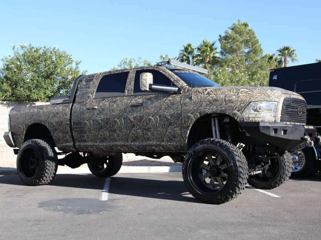 A Camouflaged Truck Parked In A Parking Lot Background