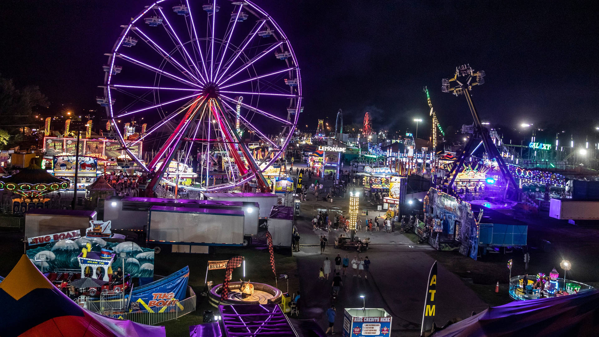 A Captivating Night At The Fair Background