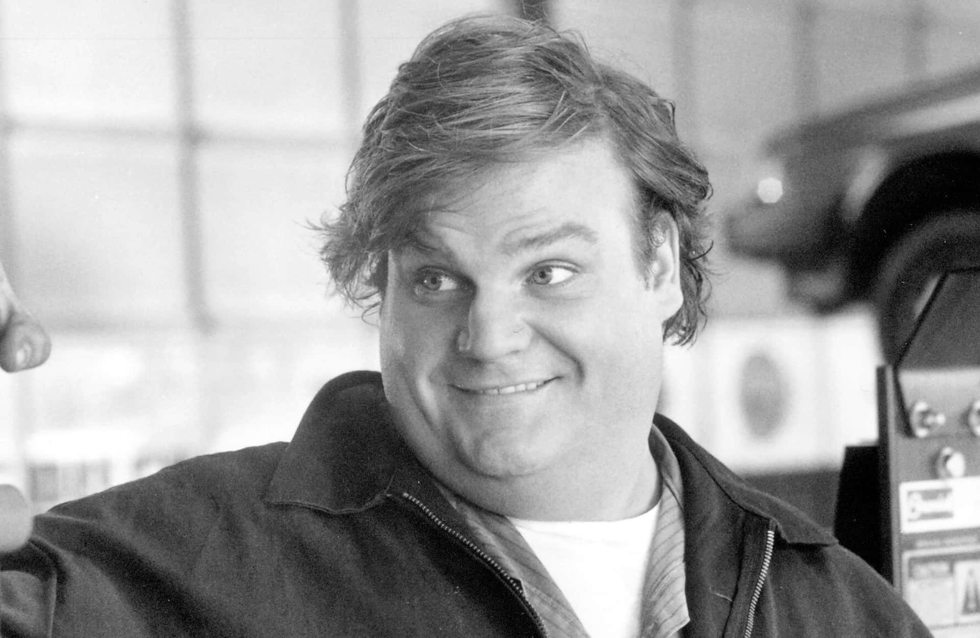 A Captivating Portrait Of Chris Farley Background