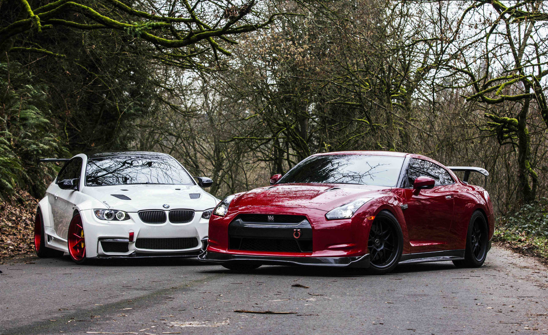 A Captivating Showdown Between The Nissan Skyline Gtr R35 And A Stunning White Bmw. Background