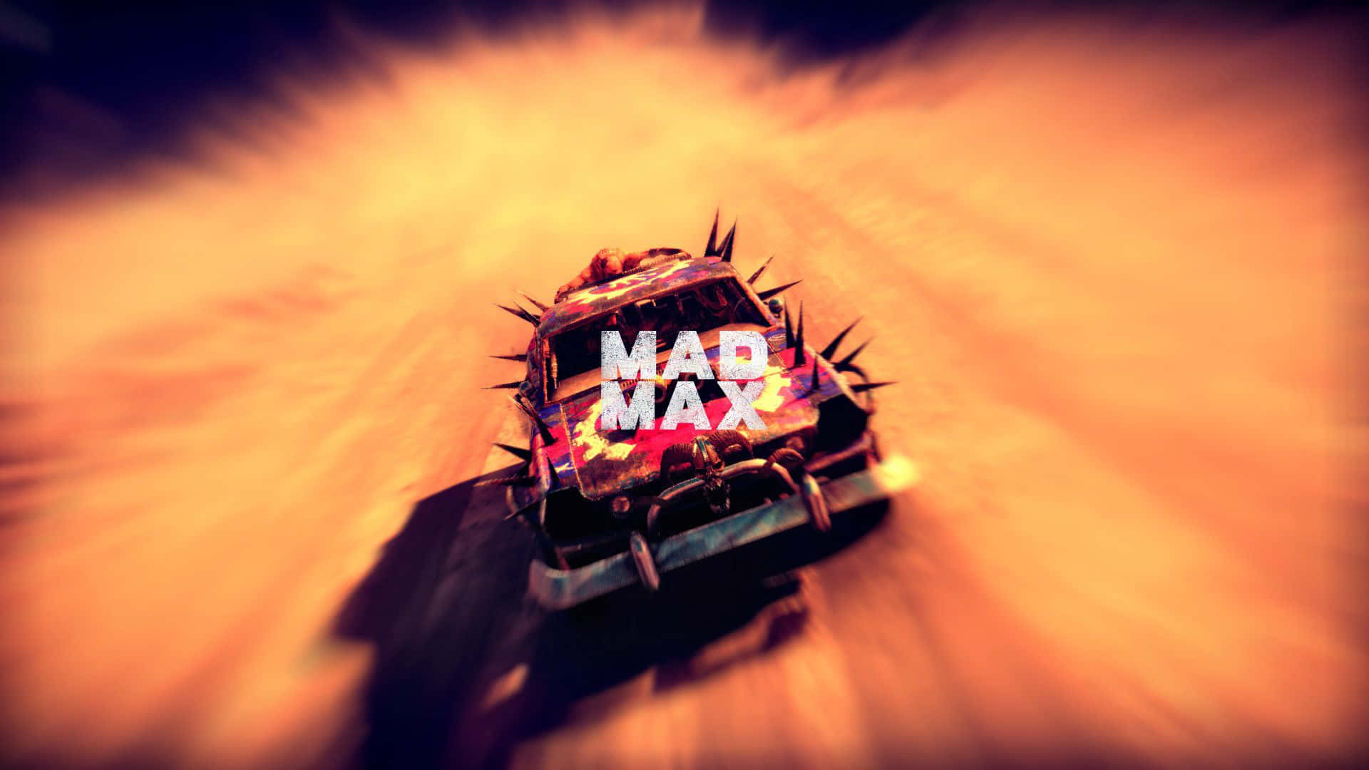 A Car Driving Down A Dirt Road With The Words Bad Max
