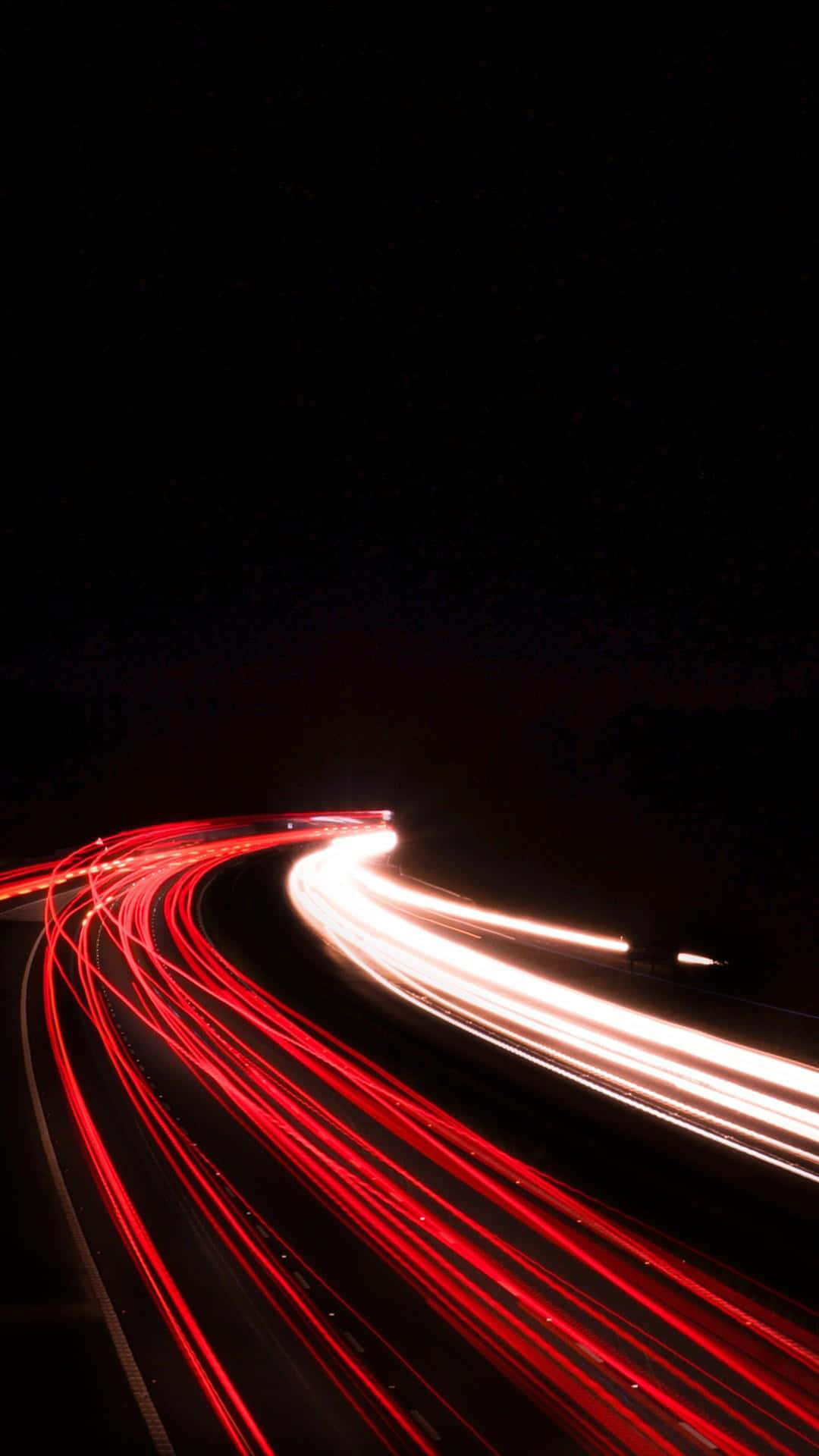 A Car Driving Down The Road Background