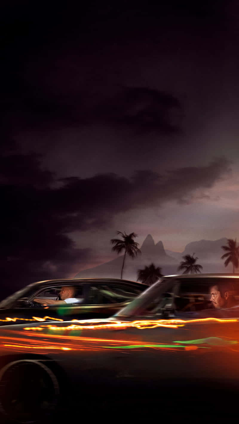 A Car Driving Down The Road