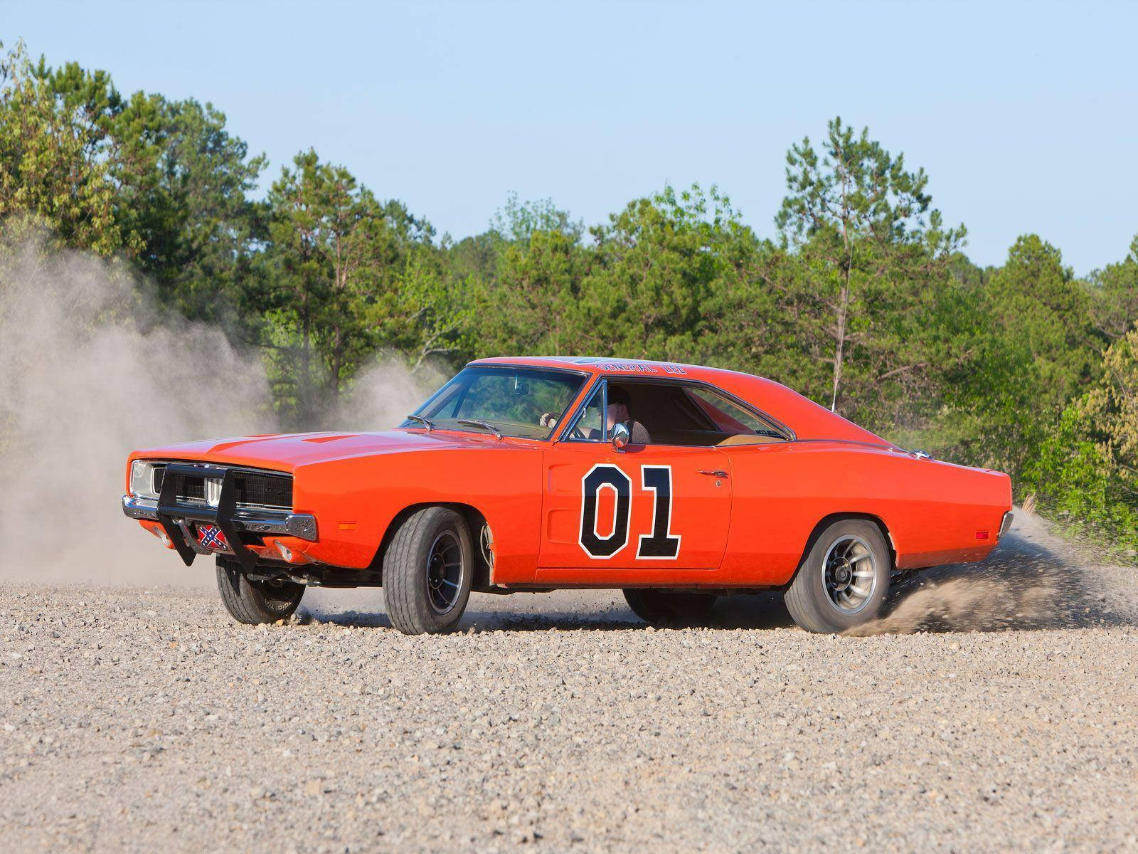 A Car Driving On Dirt Background