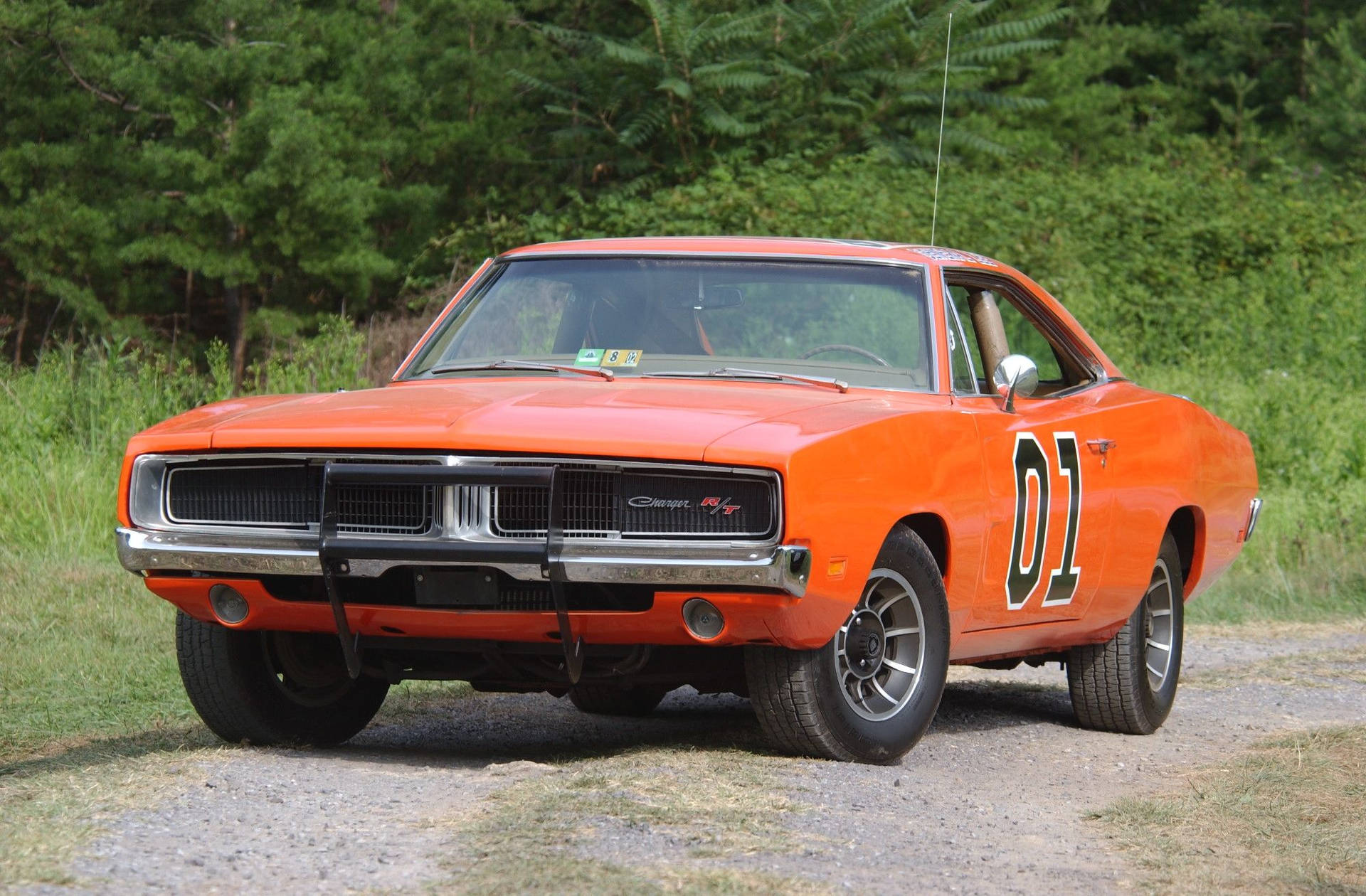 A Car On A Dirt Road Background