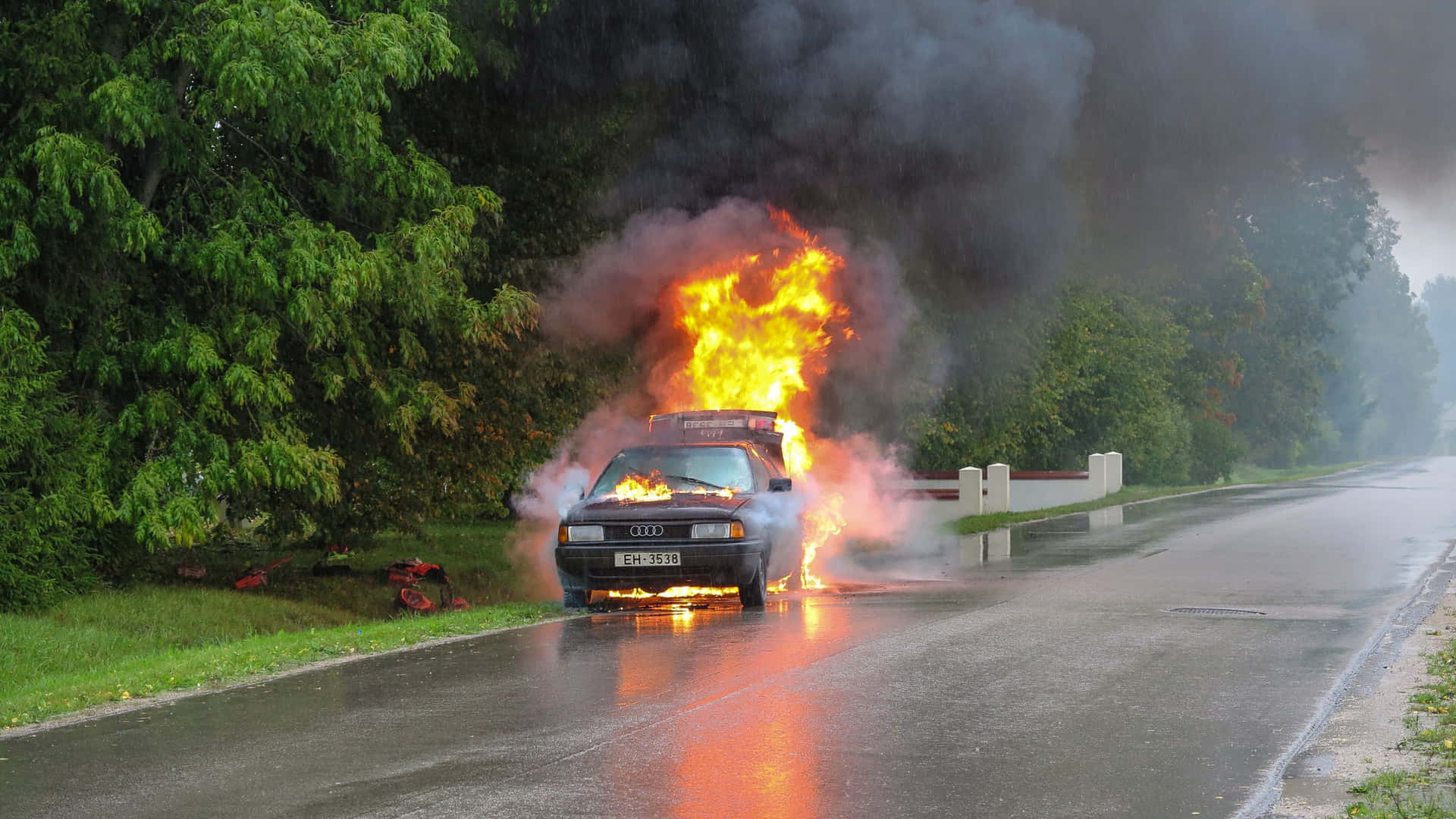 A Car On Fire On A Road